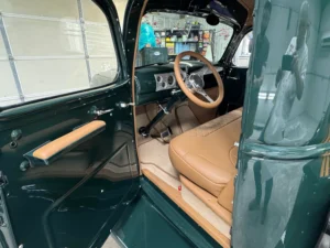 1946 Chevrolet Truck full restoration with deep green paint, chrome grille details, and polished wheels
