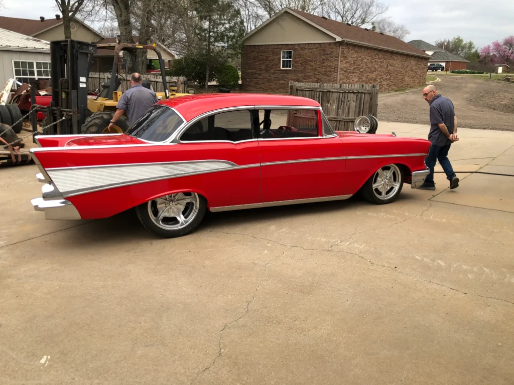 1957 Chevrolet 2-Door Hardtop complete restoration with red paint, chrome trim, and polished wheels