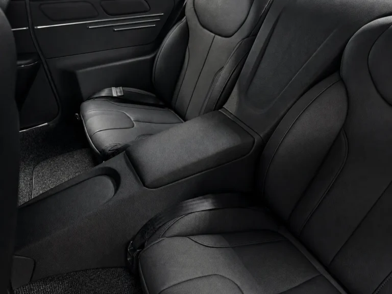 Custom black rear seats and full-length center console in a restored 1967 Chevrolet Chevelle.
