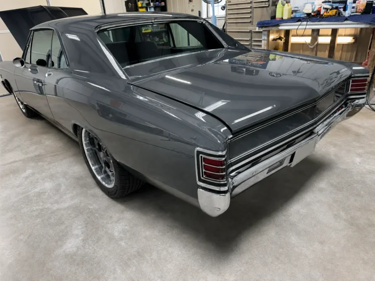 Rear three-quarter view of the completed gray 1967 Chevrolet Chevelle inside the D & D Specialty Cars workshop.