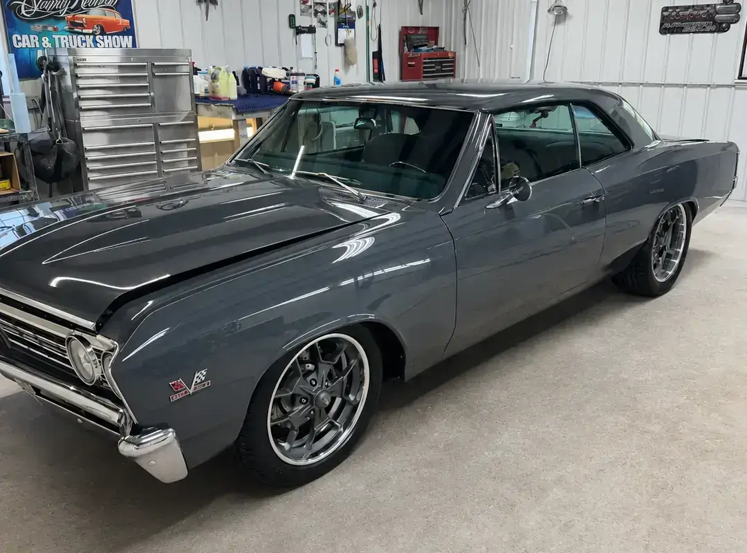 Completed gray 1967 Chevrolet Chevelle with a black roof, restored chrome, and custom wheels.