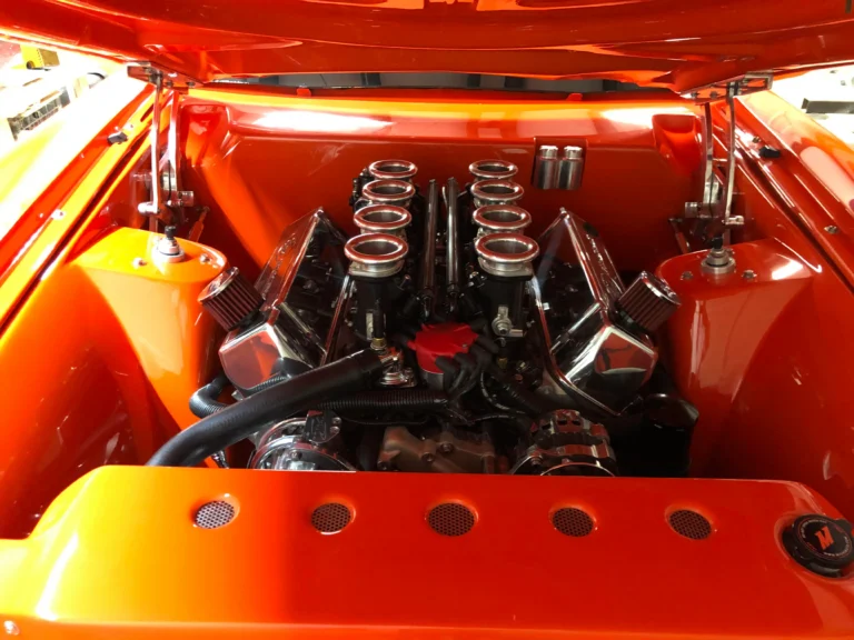 1973 Ford Mustang Mach 1 with HUNT Performance engine, 8-stack setup, and custom orange engine bay