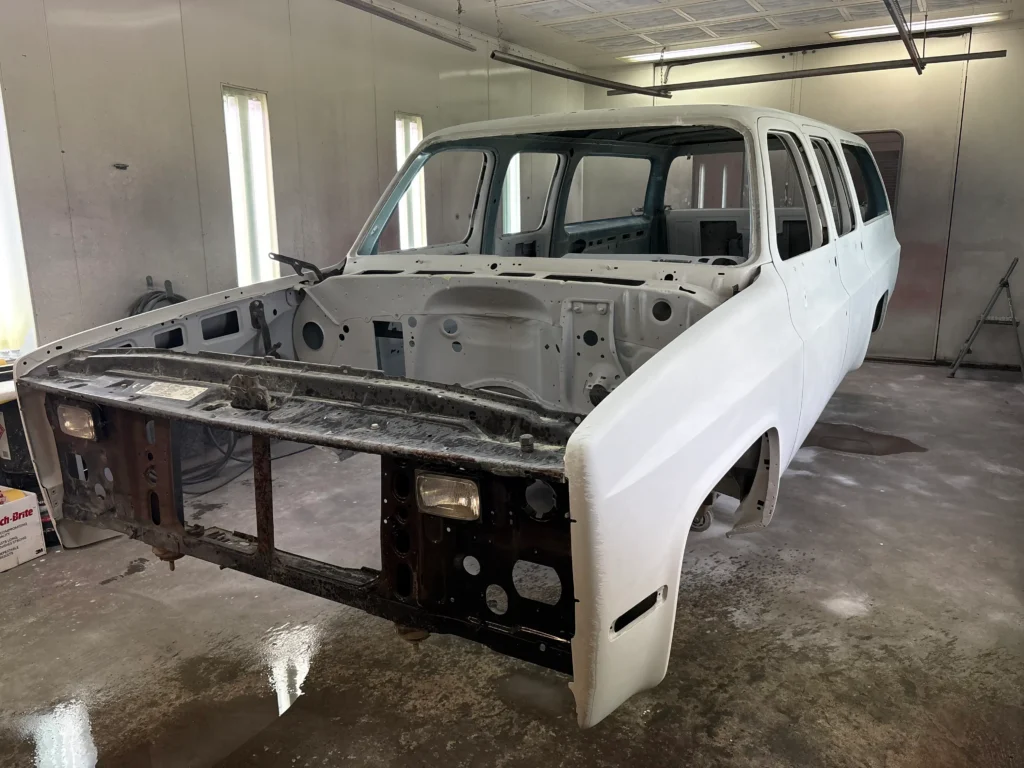 1991 Suburban frame-off restoration showing original body, front structure, and primer prep