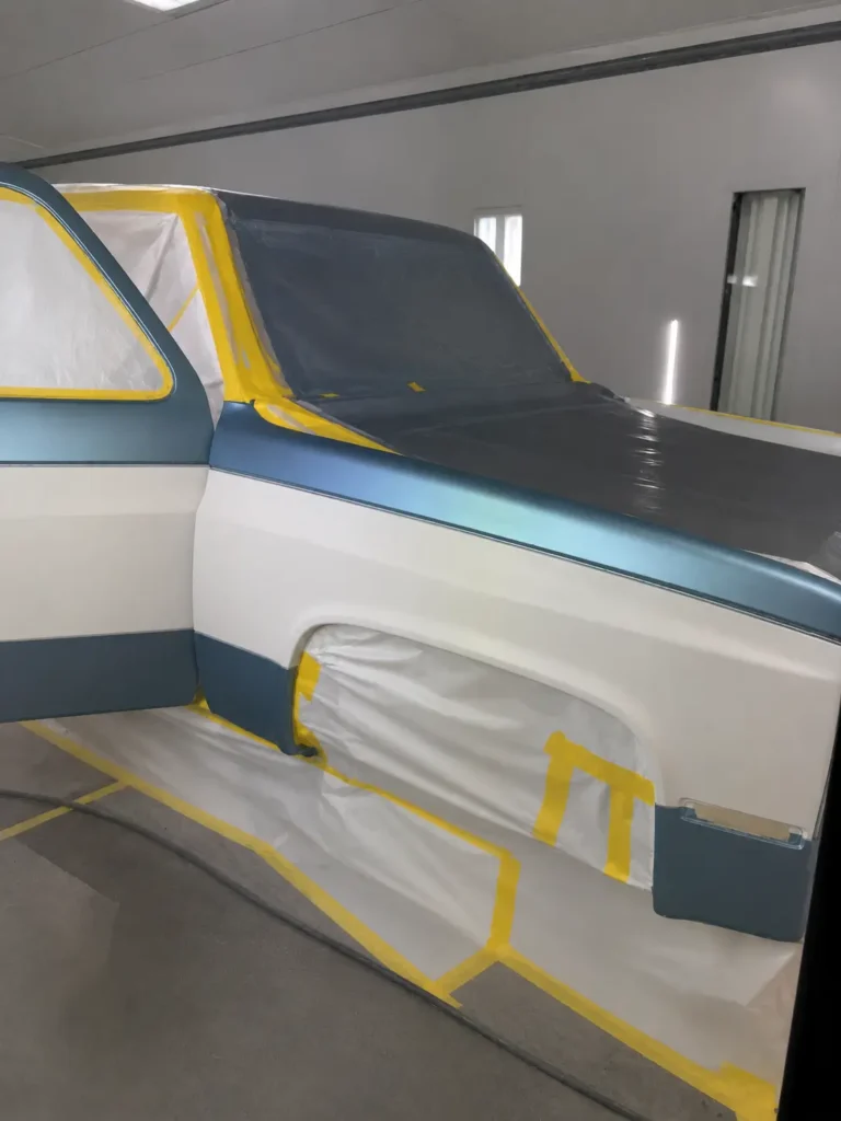 1991 Suburban restoration progress showing window glass and taped interior prep