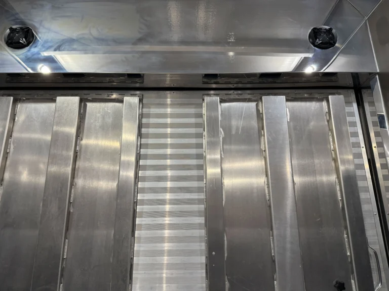 2019 Renegade Enclosed Stacker Trailer loading floor with metal tracks and interior lighting
