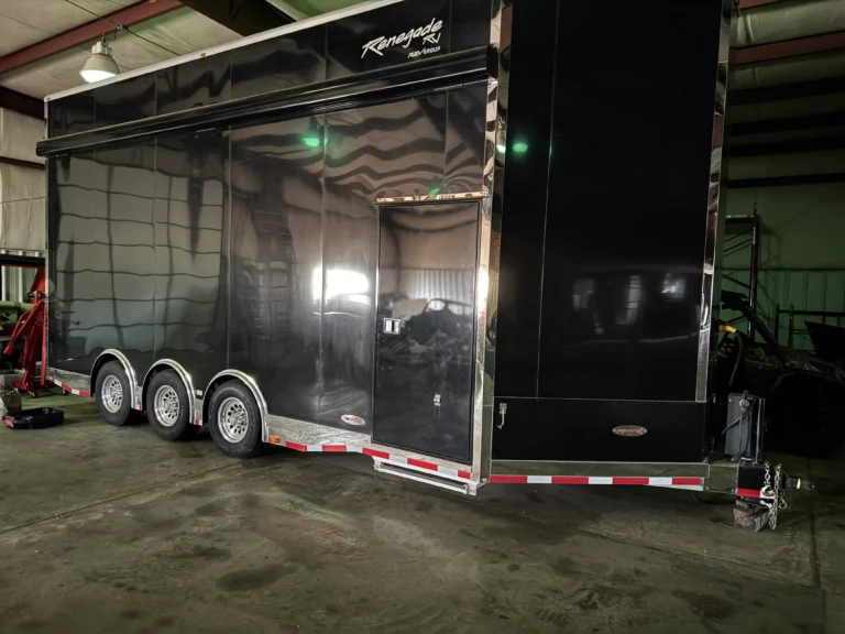 2019 Renegade Enclosed Stacker Trailer for sale with black exterior, polished trim, and multi-axle setup